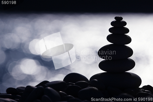 Image of Backlit Stone Stack on the Beach