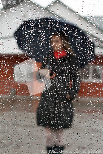 Image of Beautiful girl with red scarf and umbrella