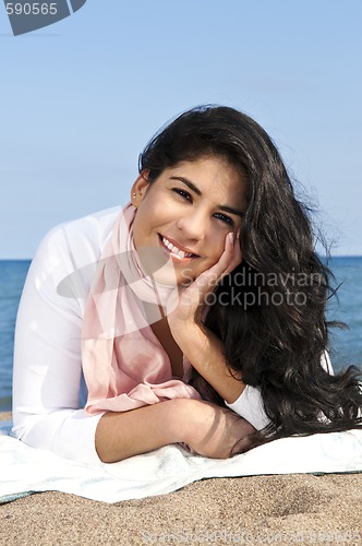 Image of Young native american woman at beach