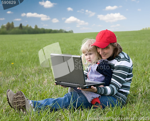 Image of mother and daughter with laptop