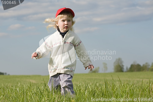 Image of little girl on green meadow