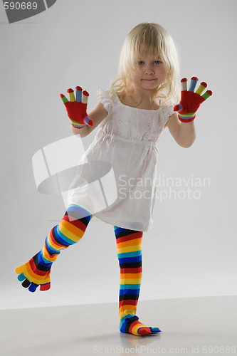 Image of little girl in multi-coloured clothes