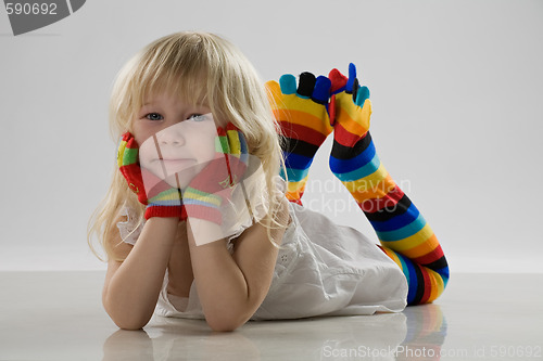 Image of little girl lie on floor