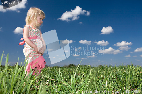 Image of toddler girl on green meadow