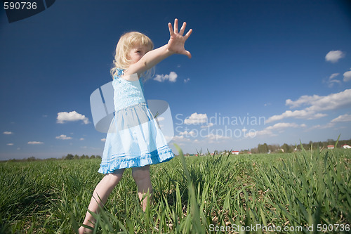 Image of little girl on sunny meadow