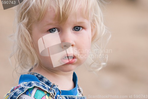 Image of blonde sad little girl