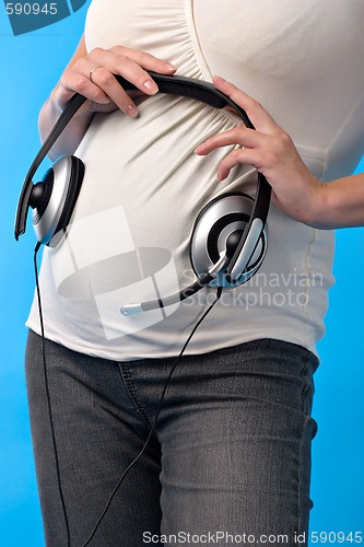 Image of pregnant woman with headphones