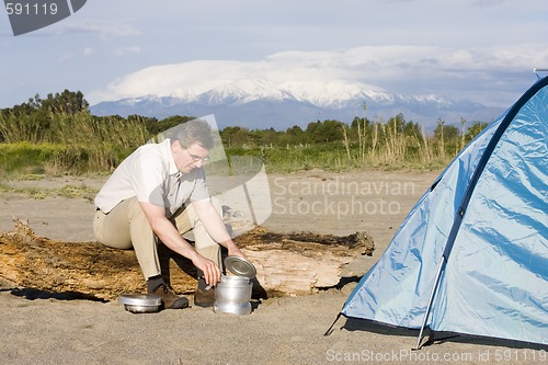 Image of Man beside his tent