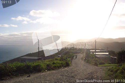 Image of sunset on coastal road