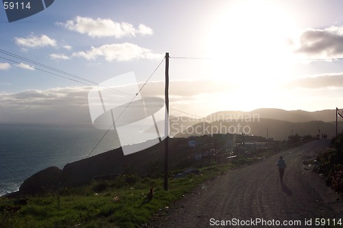 Image of sunset on coastal road