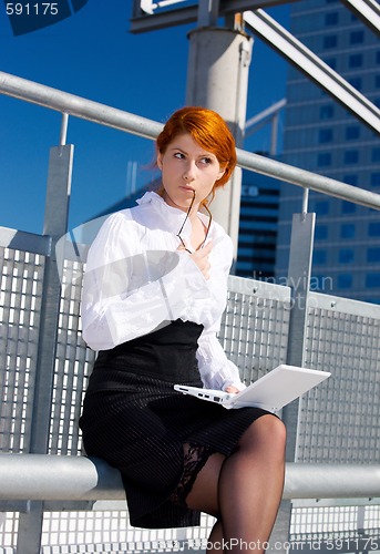 Image of pensive businesswoman