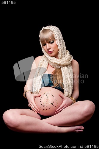 Image of Pregnant woman holding belly