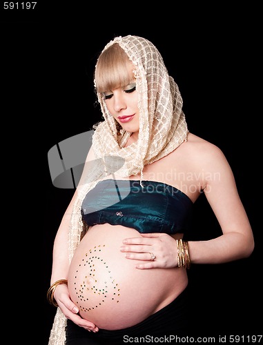 Image of Pregnant woman holding belly