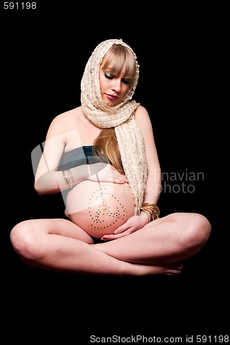 Image of Pregnant woman holding belly