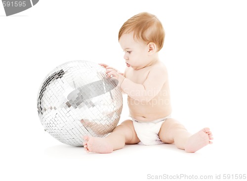 Image of adorable baby boy with big disco ball