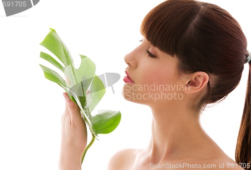 Image of woman with green leaf