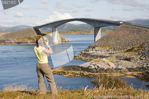 Image of Woman photographer at work