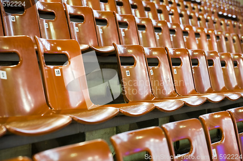 Image of rows of seats with broken one