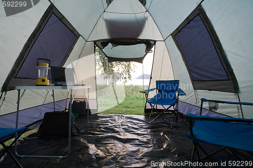Image of Into a tent in camp