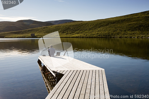 Image of man on pier