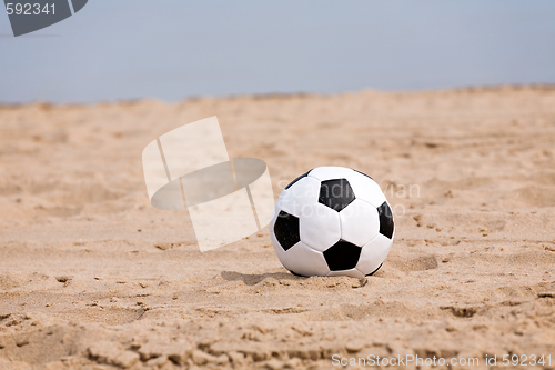 Image of soccer ball on beach