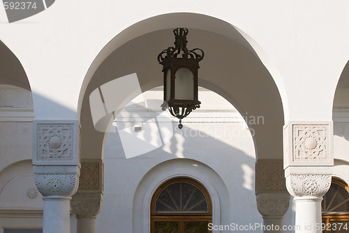 Image of street lamp hangs in an arch