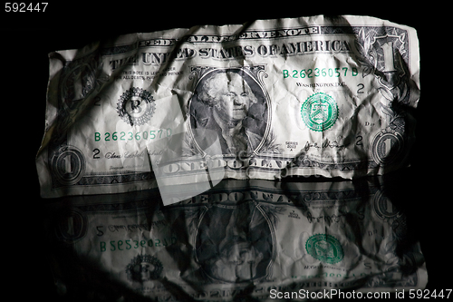 Image of Crumpled dollar isolated on black