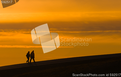 Image of silhouettes of walking people