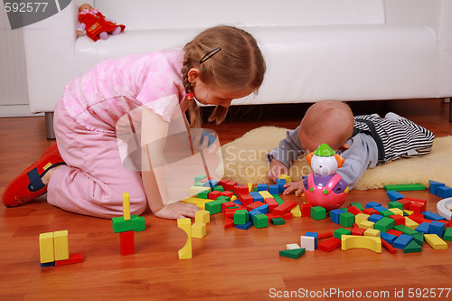 Image of Adorable kids playing with blocks