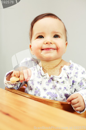 Image of Small cute baby eating