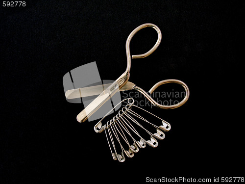 Image of Scissors  and safty pins