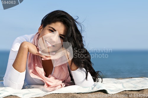 Image of Young native american woman at beach
