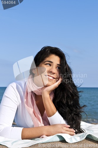 Image of Young native american woman at beach