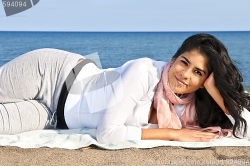 Image of Young native american woman at beach