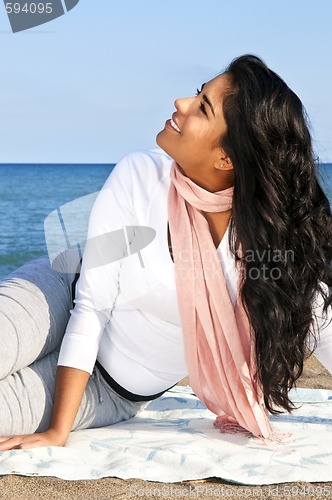 Image of Young native american woman at beach