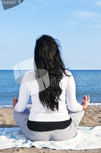 Image of Young native american woman meditating