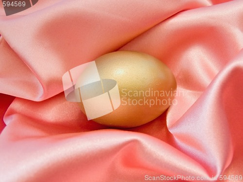 Image of Golden egg in silk