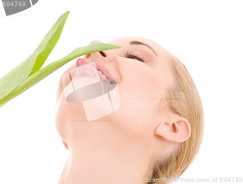 Image of happy woman with green leaf