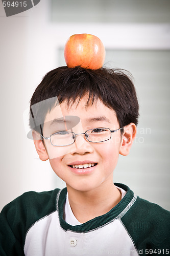 Image of A boy with an apple