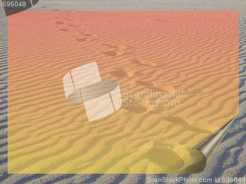 Image of sand, footsteps and transparent frame