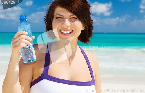 Image of happy woman with bottle of water