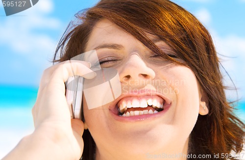 Image of happy woman with cell phone