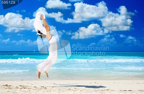 Image of happy woman with white sarong