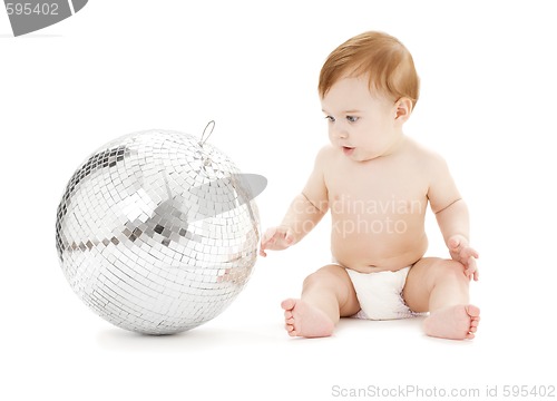 Image of adorable baby boy with big disco ball