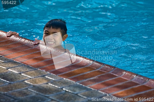 Image of Little boy in the pool