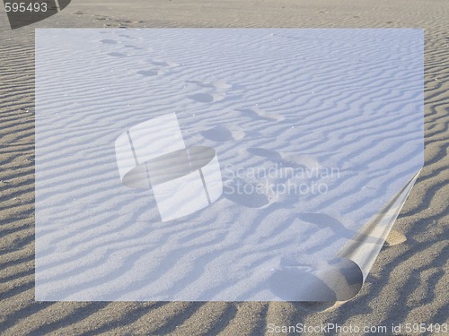 Image of footsteps in the sand with transparent frame