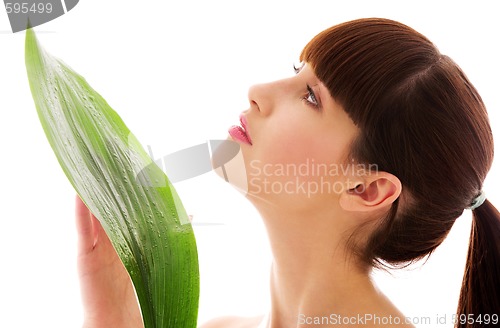 Image of woman with green leaf