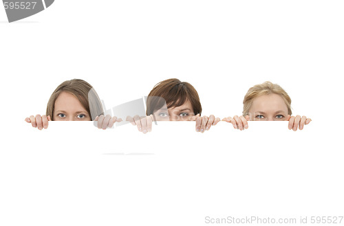 Image of Three young women behind a blank banner ad