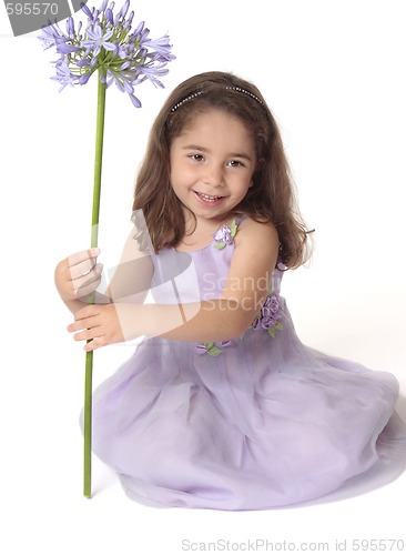 Image of Pretty girl holding flower