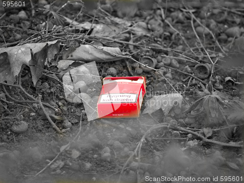 Image of Environmental - Urban pollution , cigarette pack in black and wh